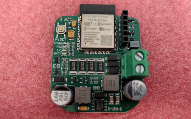 The ESP32 doorbell bus interface board: an ESP32-SOLO-1 module on Mat931's open-source PCB with a screw terminal for the bus.